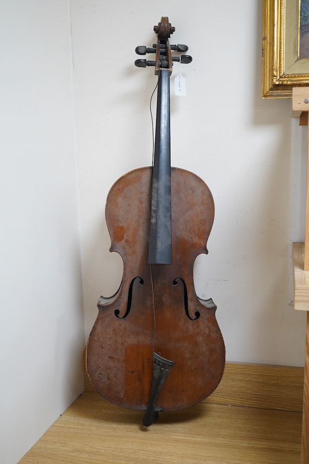 A late 19th century small cello, unsigned and without label inside body, stamped inventory number 769, length of back 62cm. Condition - poor to fair